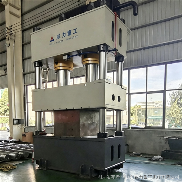Hydraulic press for forming highway guardrail panels