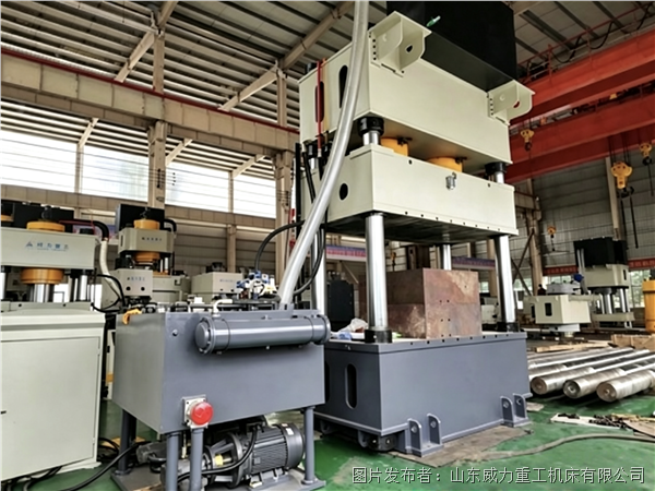 Hydraulic press for forming highway guardrail panels
